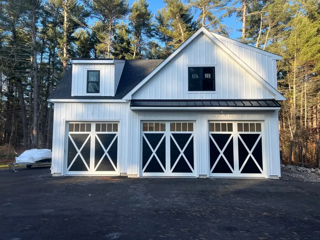 Carriage style garage doors on farmhouse