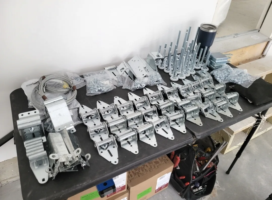 Garage door hardware parts including springs and cables