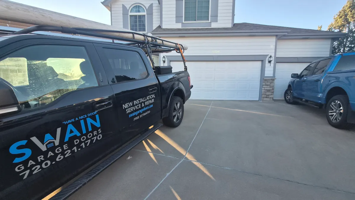 Swain Garage Doors service truck on-site for garage door repair in Thornton, CO
