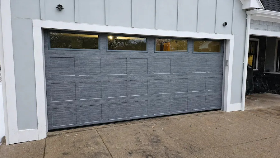 New charcoal garage door installed on Denver area home by Swain Garage Doors