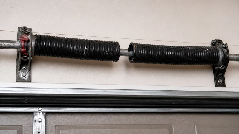 Broken garage door torsion spring in Arvada home