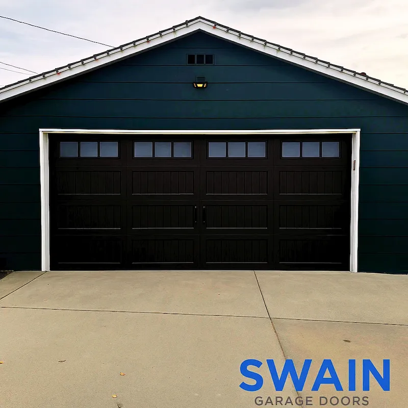 Dark double-car garage door installation in Denver metro area — Swain Garage Doors